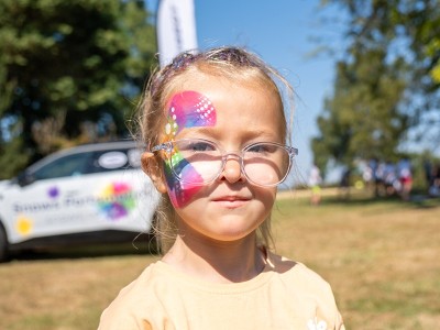 Girl face painted at Colour Dash 2026 