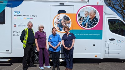 Vaccination team outside vehicle.jpg