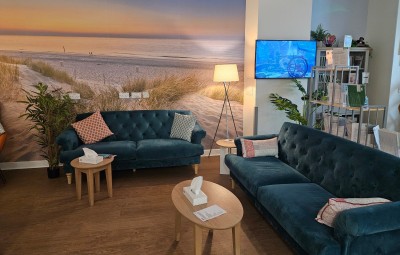 Main Waiting Area 5 sofas wall art tv.jpg